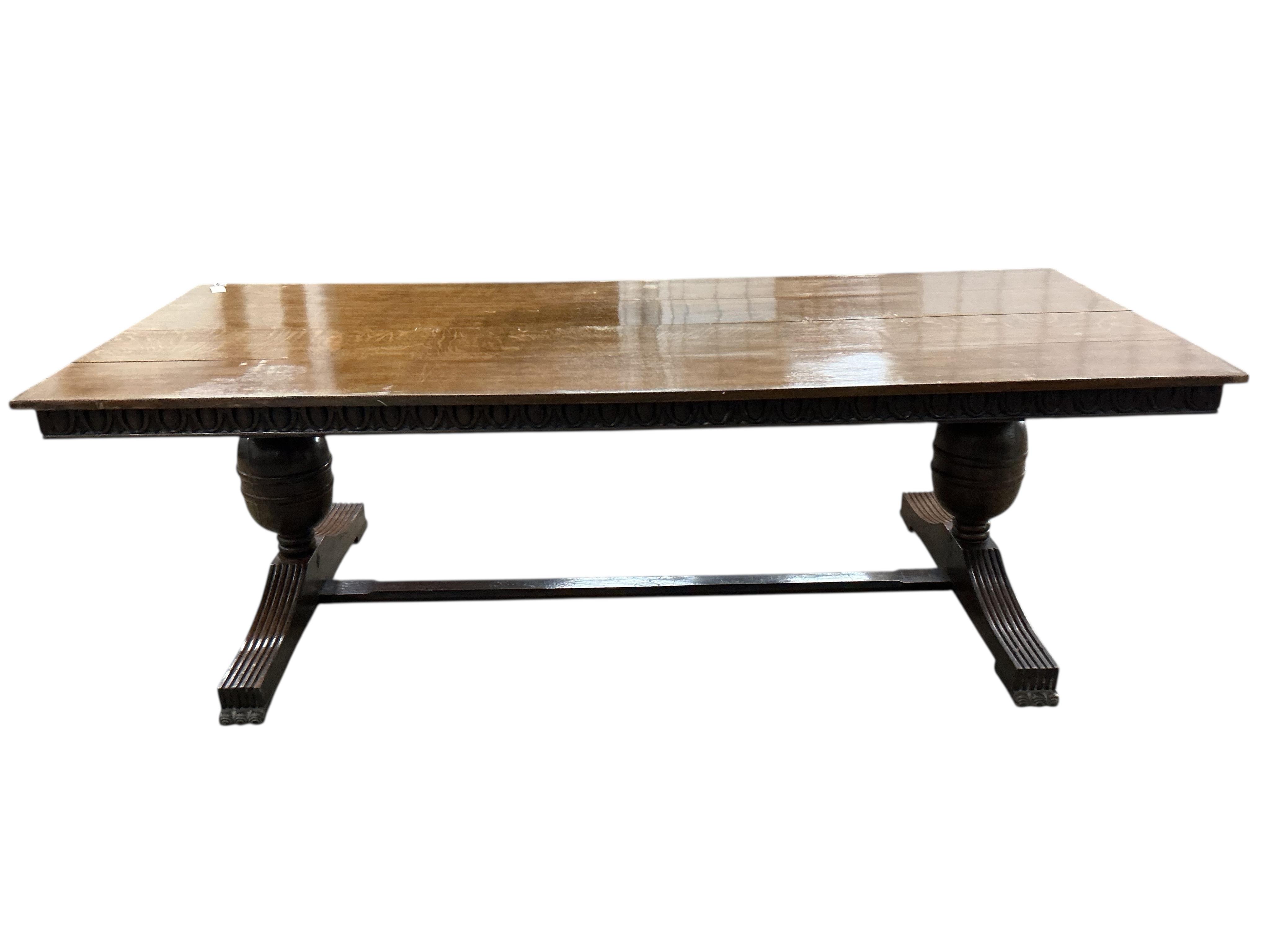 An 18th century style rectangular oak refectory dining table, width 243cm, depth 103cm, height 76cm